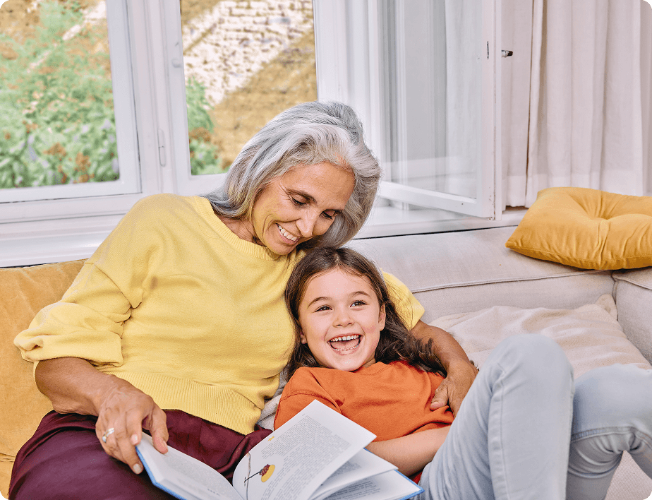 grandma reading for his granddaughter